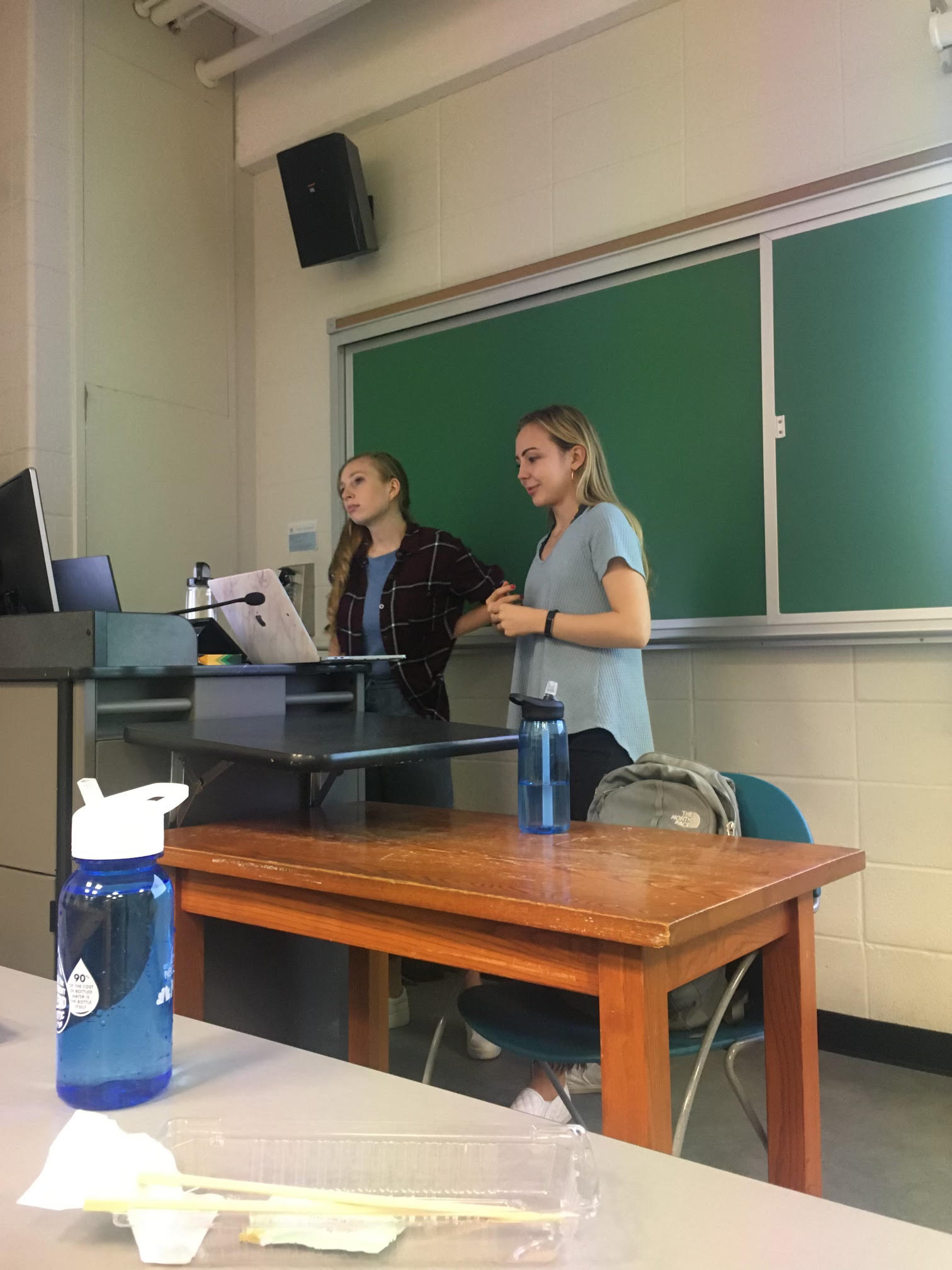Anastasia Dmitrienko and fellow TA Sophia Kolak giving a midterm recitation for CS Theory.